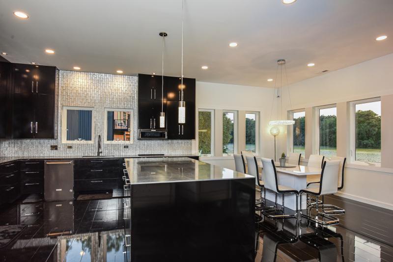 Josh Dickson also built the kitchen counters and island, and installed all the tile. He estimates he saved at least $200,000 by doing the work himself, which he said he would not have been able to do without his trades knowledge. JOHN MOLLURA PHOTO